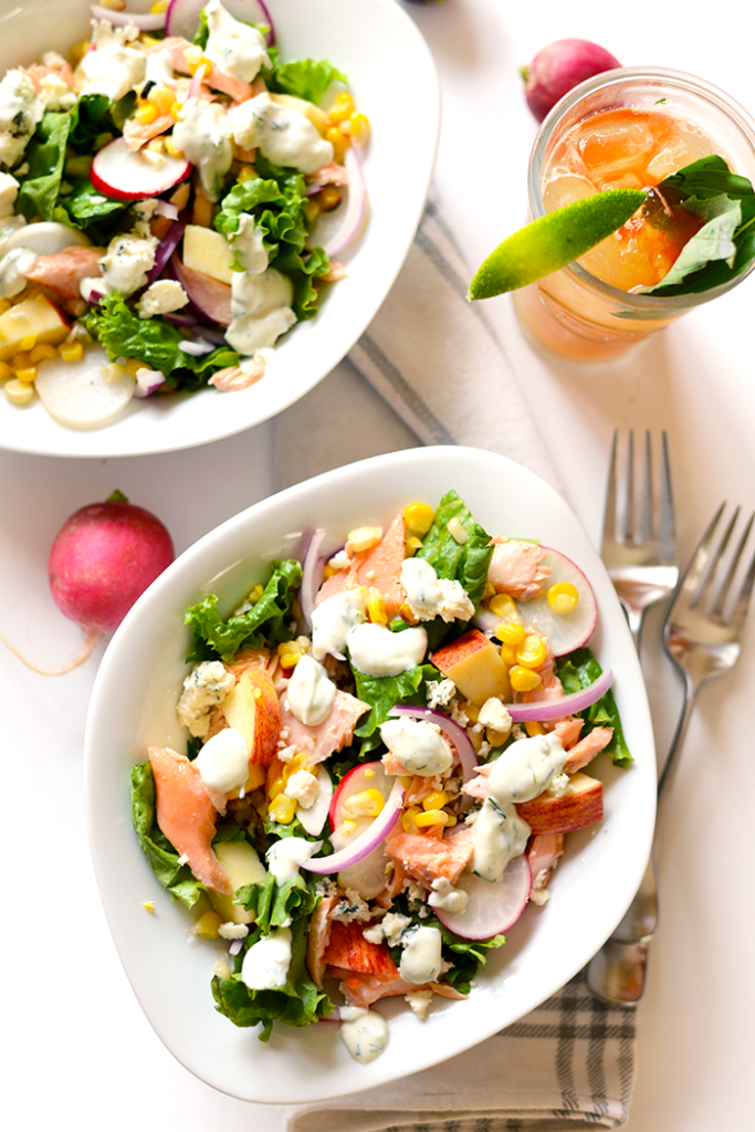 This delicious salmon salad is packed with flavor from grilled corn to fresh radishes to apple chunks and is topped with a healthy, homemade Greek yogurt dill dressing!