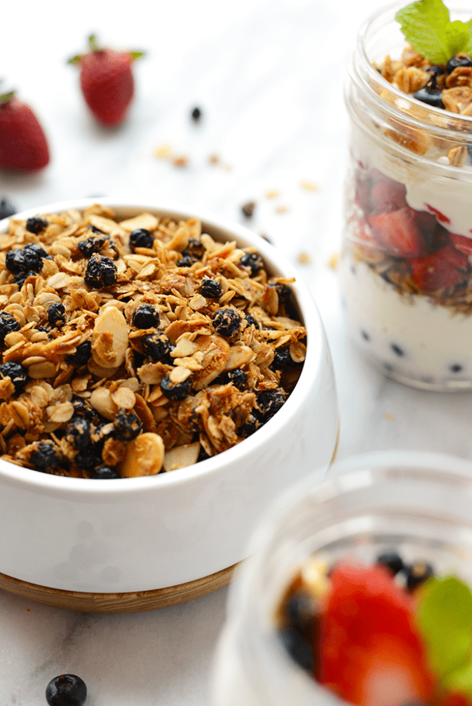 Yogurt and Granola Parfait - Layer up Greek yogurt, fresh berries, and your favorite homemade granola for the simplest mason jar parfait breakfast!"