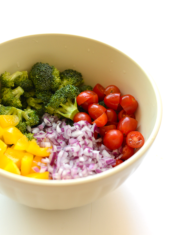 Make this quinoa pasta salad with seasonal veggies, homemade Italian dressing, and tons of spices for a delicious summertime salad that doubles as dinner!