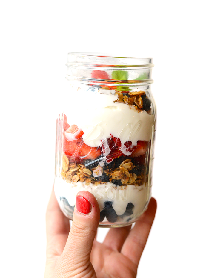 Yogurt and Granola Parfait - Layer up Greek yogurt, fresh berries, and your favorite homemade granola for the simplest mason jar parfait breakfast!"