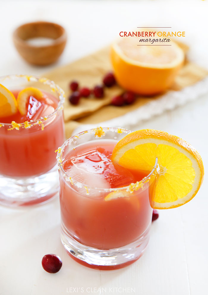 This Cranberry Orange Margarita is a festive spin on your classic Margarita, perfect for your next party. Fresh squeezed orange juice, tequila, a touch of real cranberry juice, and a dash of sweetness and orange zest make this margarita the perfect holiday cocktail!