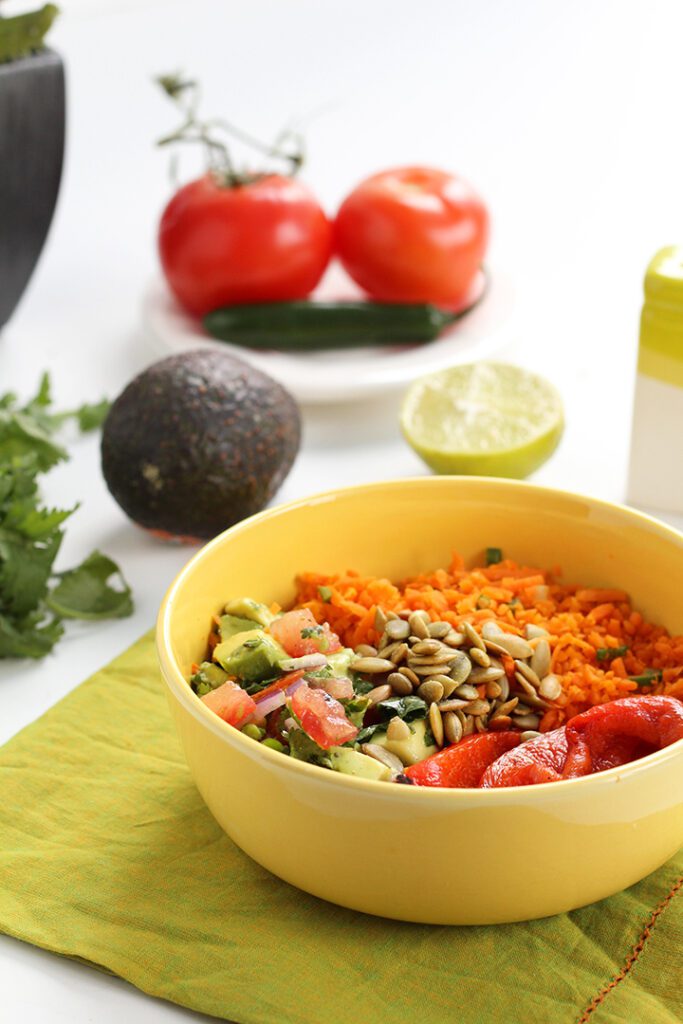 Jalapeño Carrot Rice Salad with Avocado, Roasted Pepitas & Charred Red Peppers