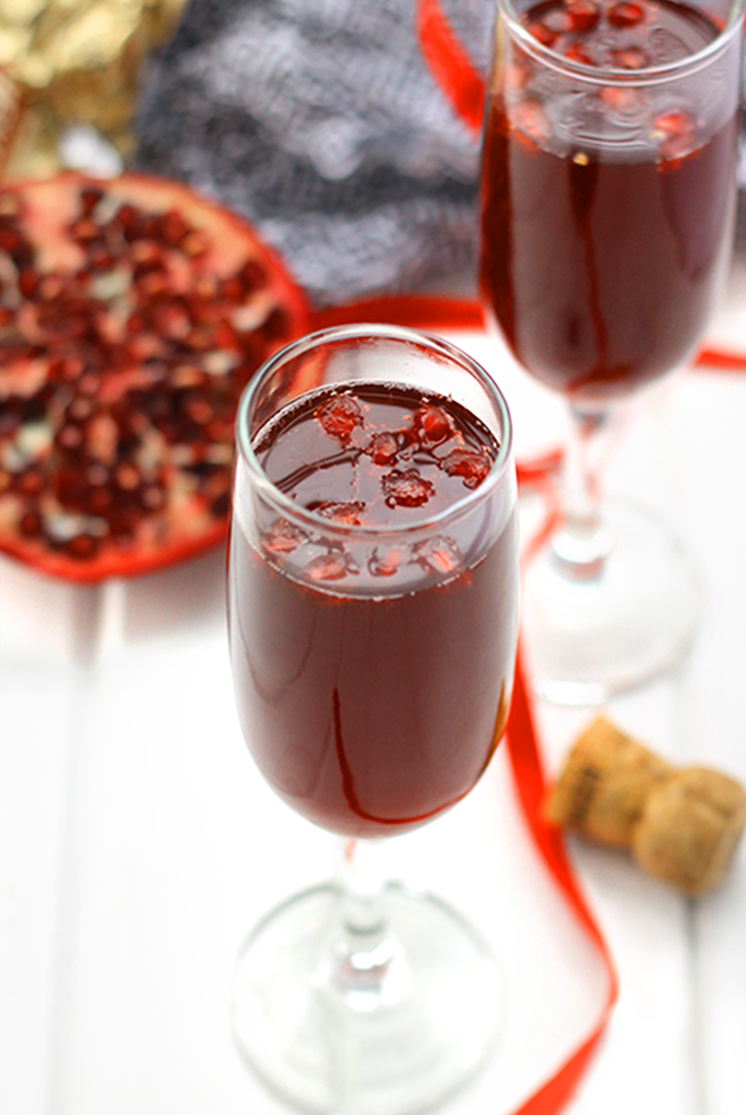 This Pomegranate Champagne Martini makes the perfect celebratory cocktail for your next party. It's sweetened with a touch of honey and pomegranate juice for a healthier drink recipe.