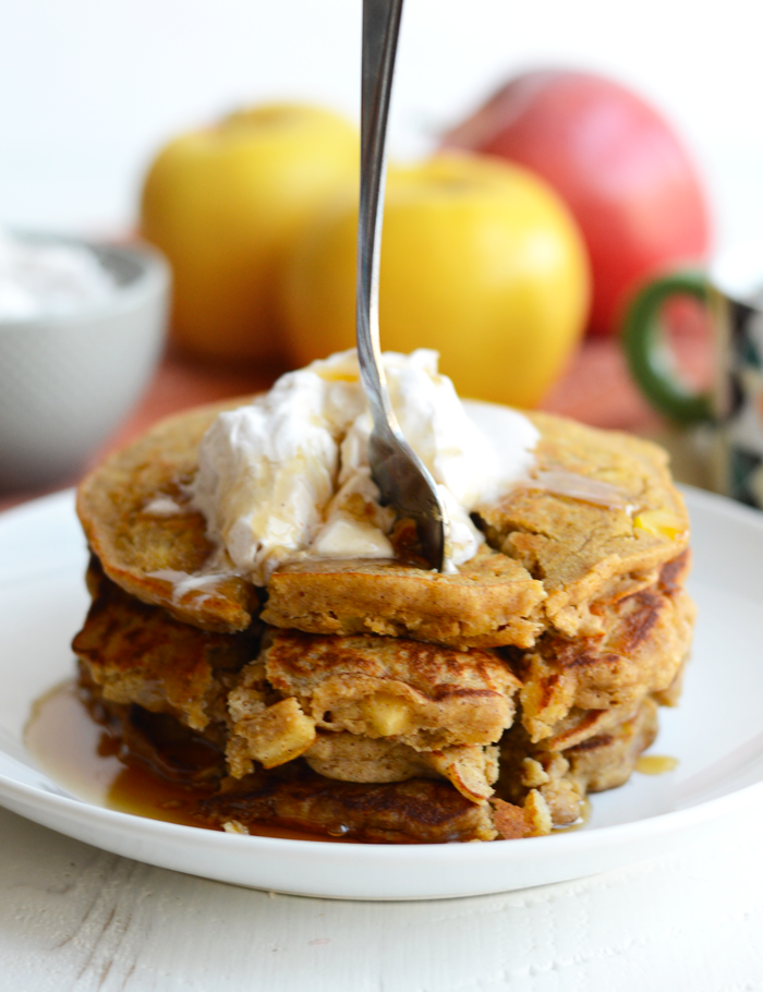 These Gluten-Free Apple Cinnamon Oat Pancakes are hearty and delish. They are made with 100% whole grains, no refined sugars, and real apple chunks!  