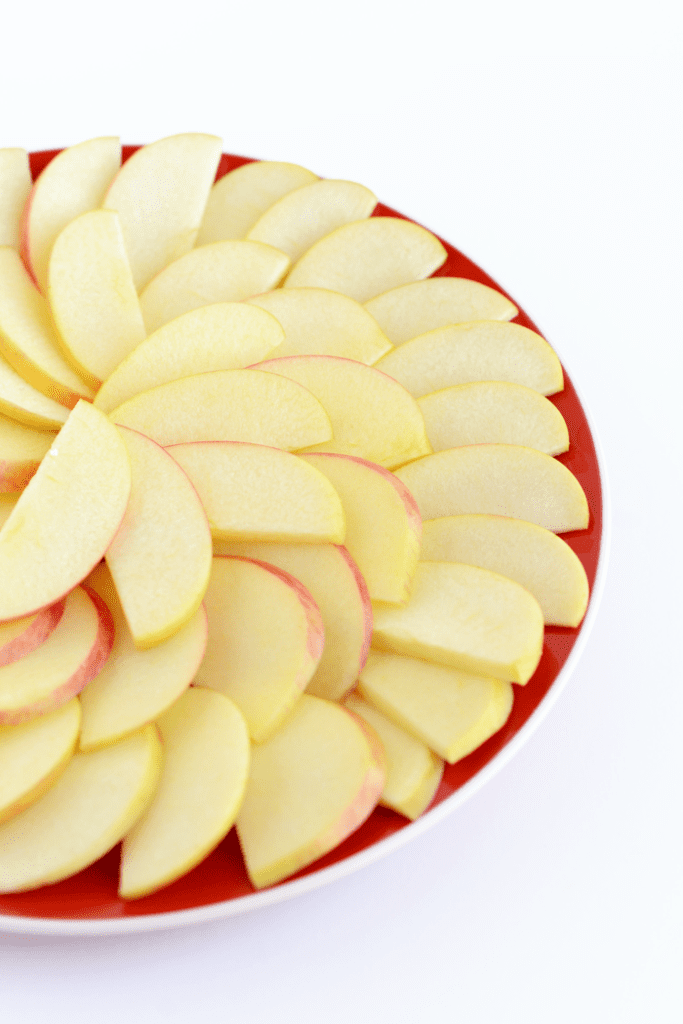 Looking for a healthy, kid-friendly snack idea? Slice up some apples and dress them up with nut butter, honey, seeds, and dried fruit to make apple nachos!