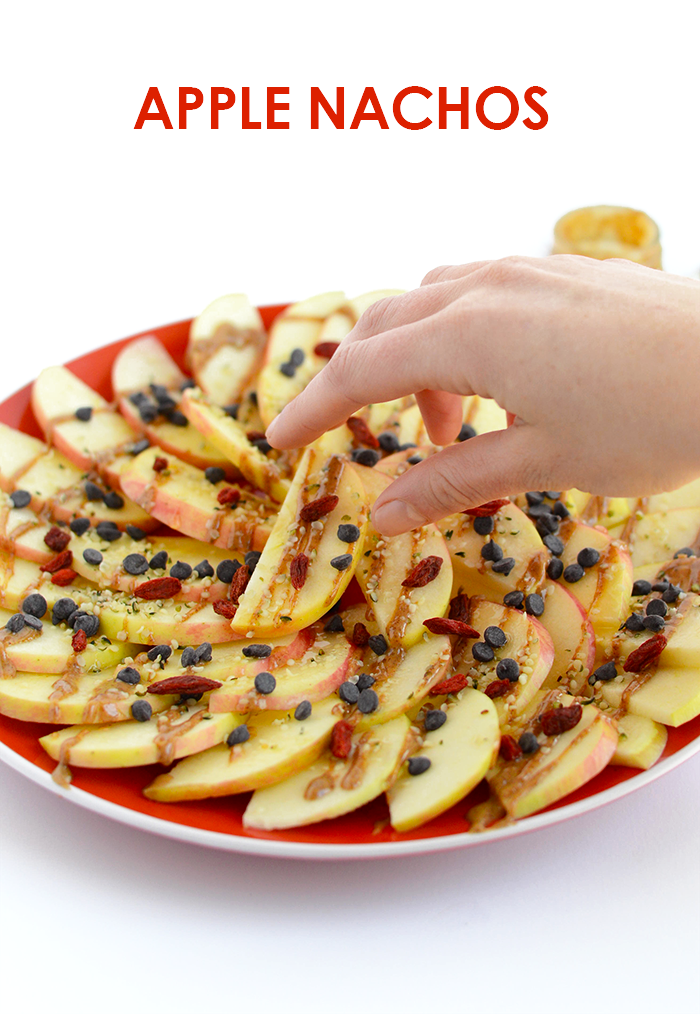 Looking for a healthy, kid-friendly snack idea? Slice up some apples and dress them up with nut butter, honey, seeds, and dried fruit to make apple nachos! 