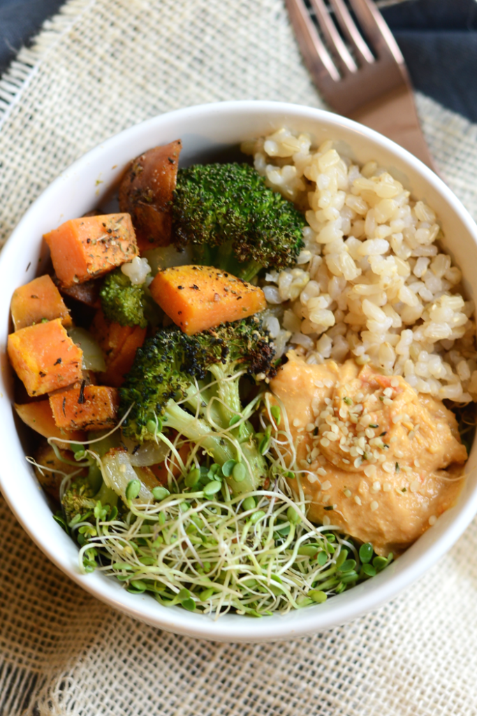 Vegetarian Brown Rice Bowl with roasted veggies, hummus, hemp seeds, and sprouts!