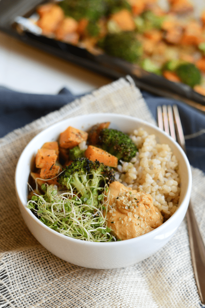 Vegetarian Brown Rice Bowl with roasted veggies, hummus, hemp seeds, and sprouts!