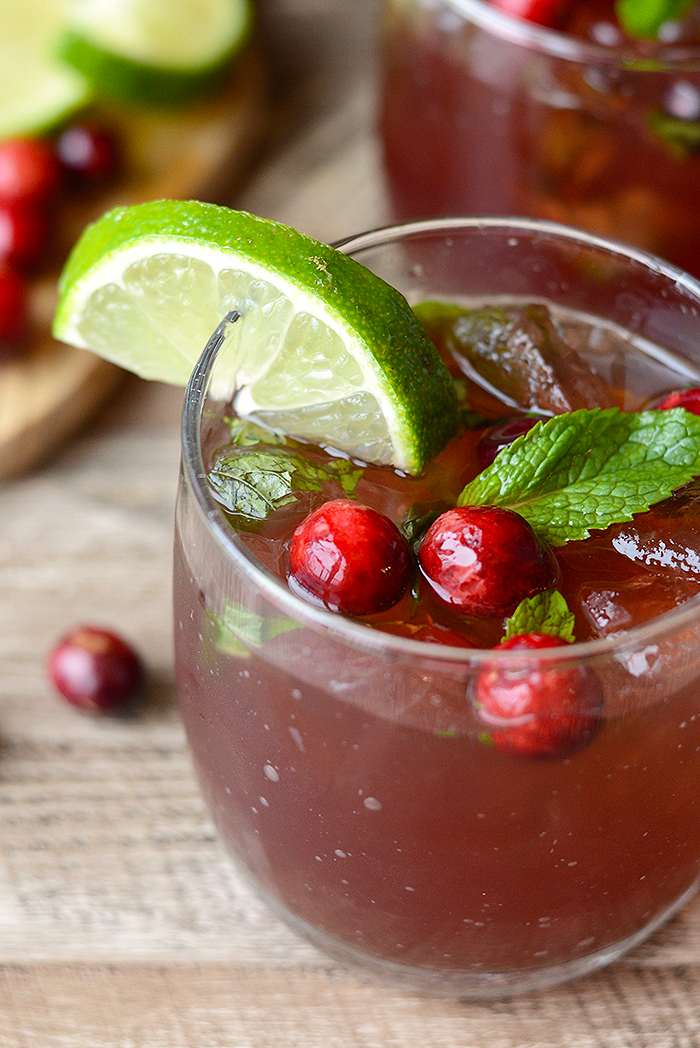 Get festive this winter and make these delicious and refreshing Cranberry Mojitos! They're made with all the classic mint mojito flavors with a splash of cranberry juice.