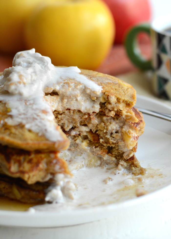 These Gluten-Free Apple Cinnamon Oat Pancakes are hearty and delish. They are made with 100% whole grains, no refined sugars, and real apple chunks!