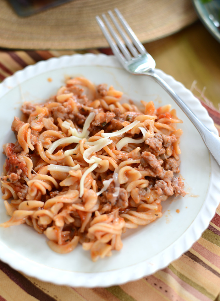 Gluten Free Sausage Pizza Pasta made with brown rice noodles and homemade meat sauce.