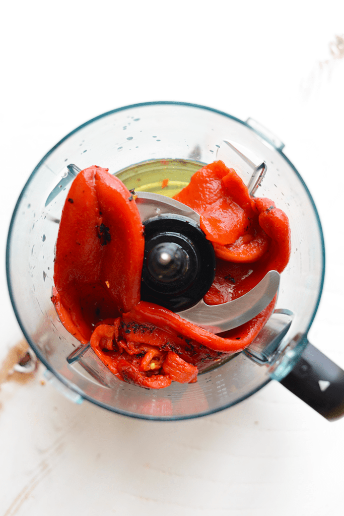 Looking for a high-protein vegetarian chili that's packed with flavor and easy to make? Use one single pot and make this Roasted Red Pepper Quinoa Chili!