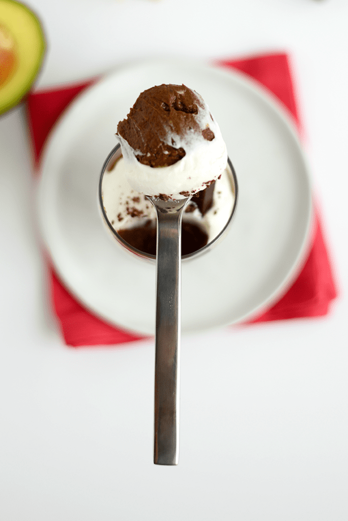 This Paleo Salted Dark Chocolate Mousse is made with an avocado and coconut base, sweetened with maple syrup, and topped off with Himalayan Sea Salt!