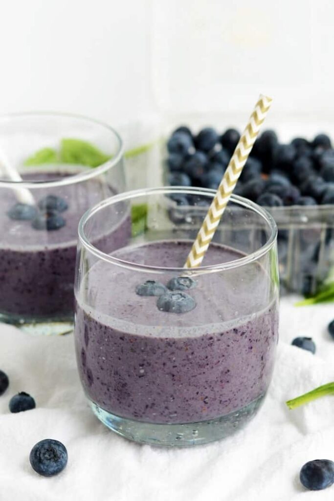 A powerhouse superfood smoothie made with blueberries, flax seed, spinach, and coconut milk.