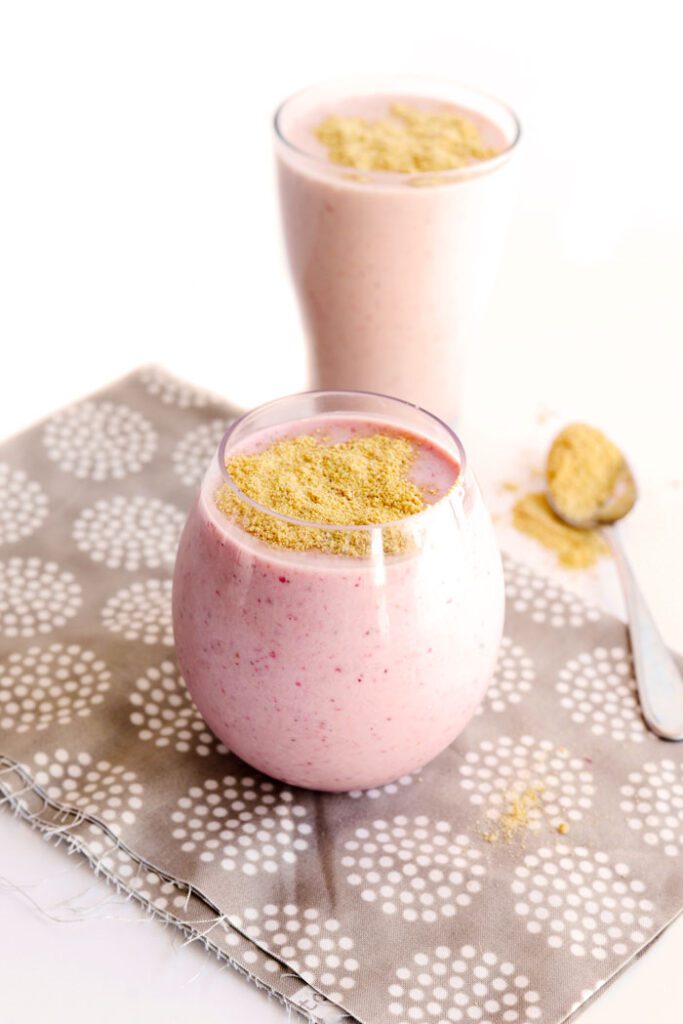 Strawberry Cheesecake Protein Smoothie- a delicious on-the-go meal packed with over 25g protein!