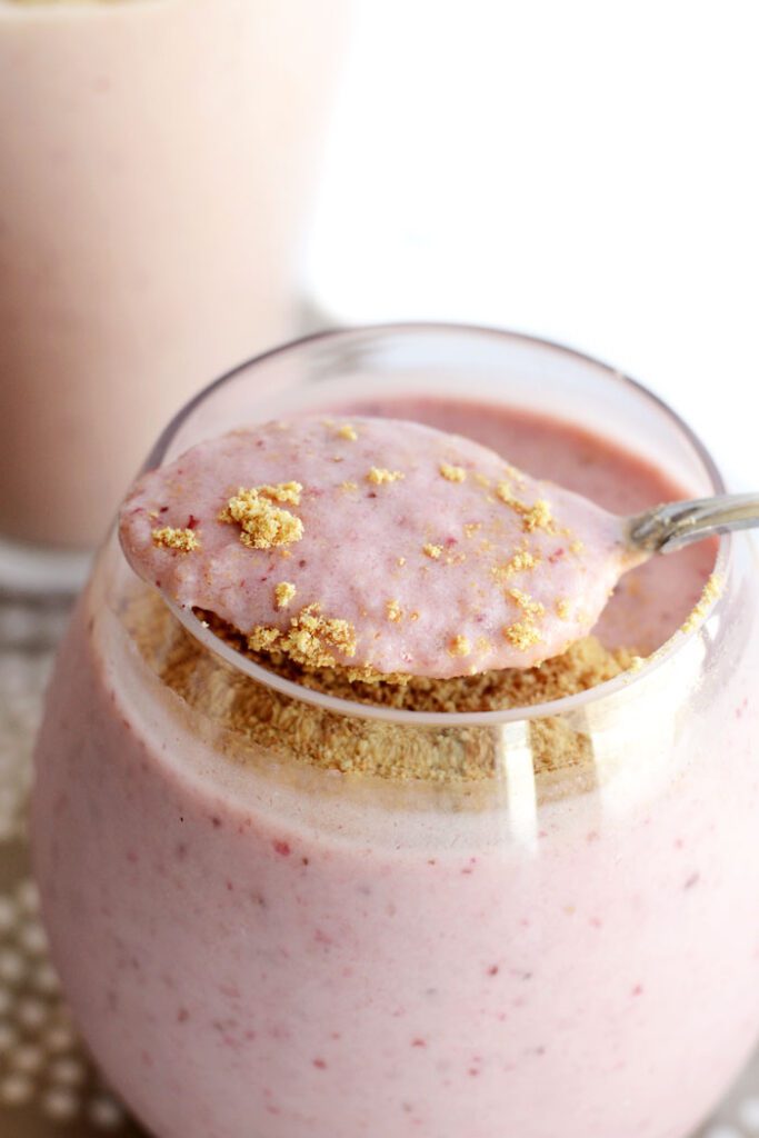 Strawberry Cheesecake Protein Smoothie- a delicious on-the-go meal packed with over 25g protein!