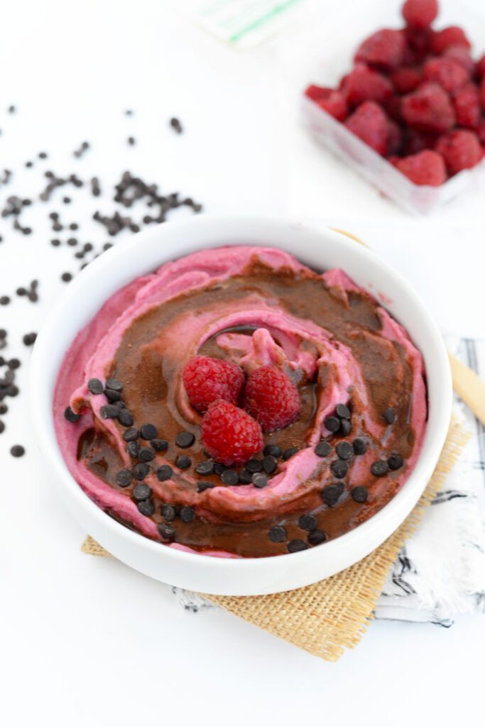 There's nothing better than a 5 minute dessert that is both vegan and paleo friendly. Make this Raspberry Banana Soft Serve with Chocolate Swirl for a guilt-free treat!