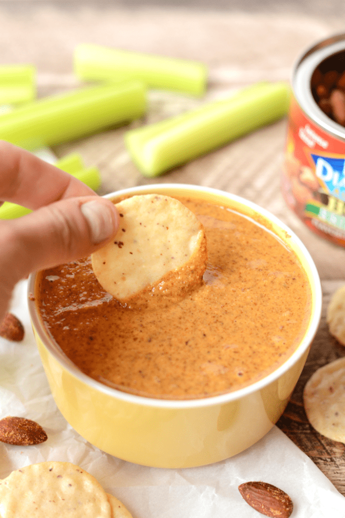 Get spicy with your nut butters and whirl up this sriracha almond butter for the most amazing veggie and cracker dip EVER. All you need is a single ingredient!