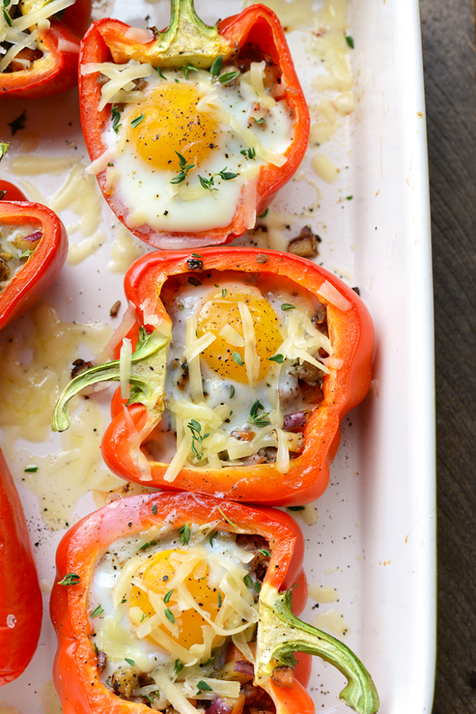 Get your meal prep on with these delicious breakfast stuffed peppers! They're made with a breakfast sausage/sweet potato hash mixture on the bottom and a baked egg on top.