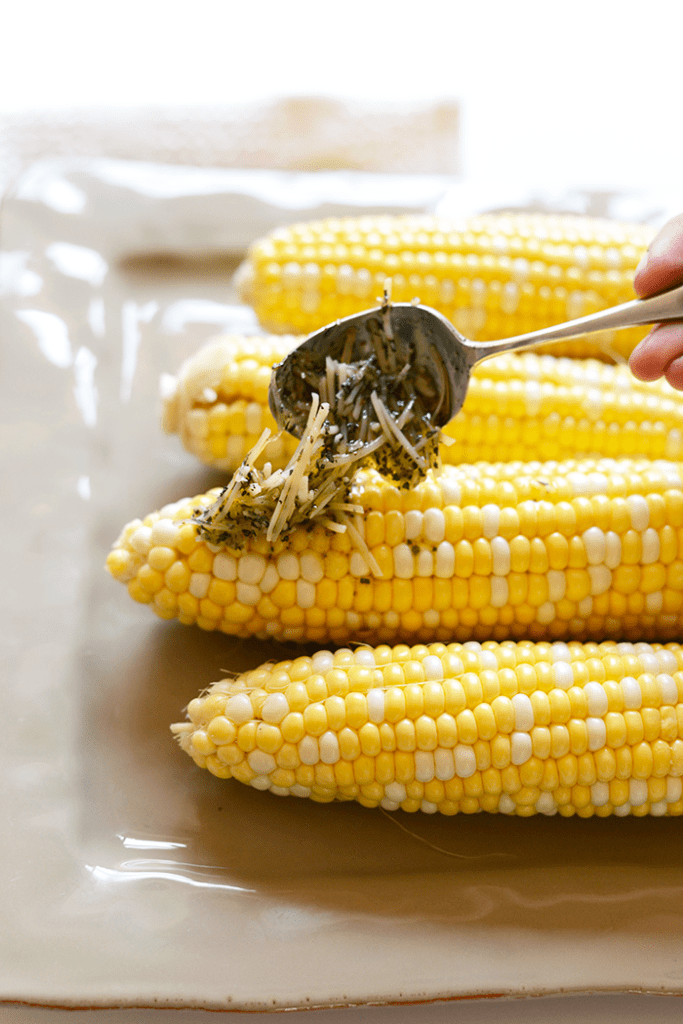 Spice up your corn with Olive Oil and parmesan cheese for the most flavorful, EASY summertime side that can be made right at home on your grill!