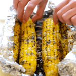 Spice up your corn with Olive Oil and parmesan cheese for the most flavorful, EASY summertime side that can be made right at home on your grill!