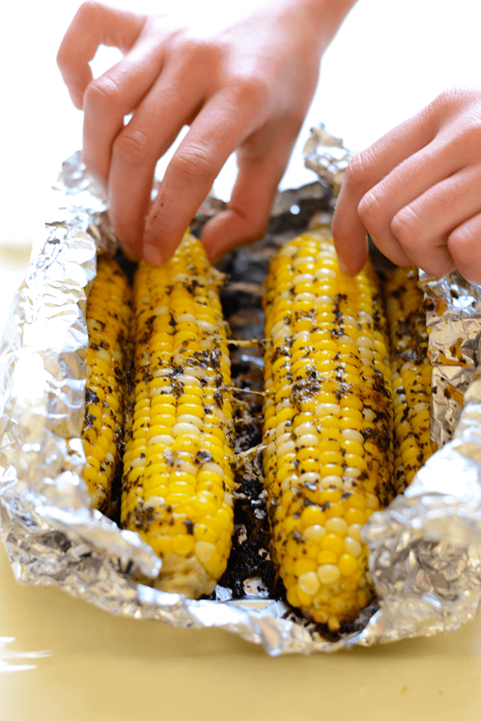 Spice up your corn with Olive Oil and parmesan cheese for the most flavorful, EASY summertime side that can be made right at home on your grill!